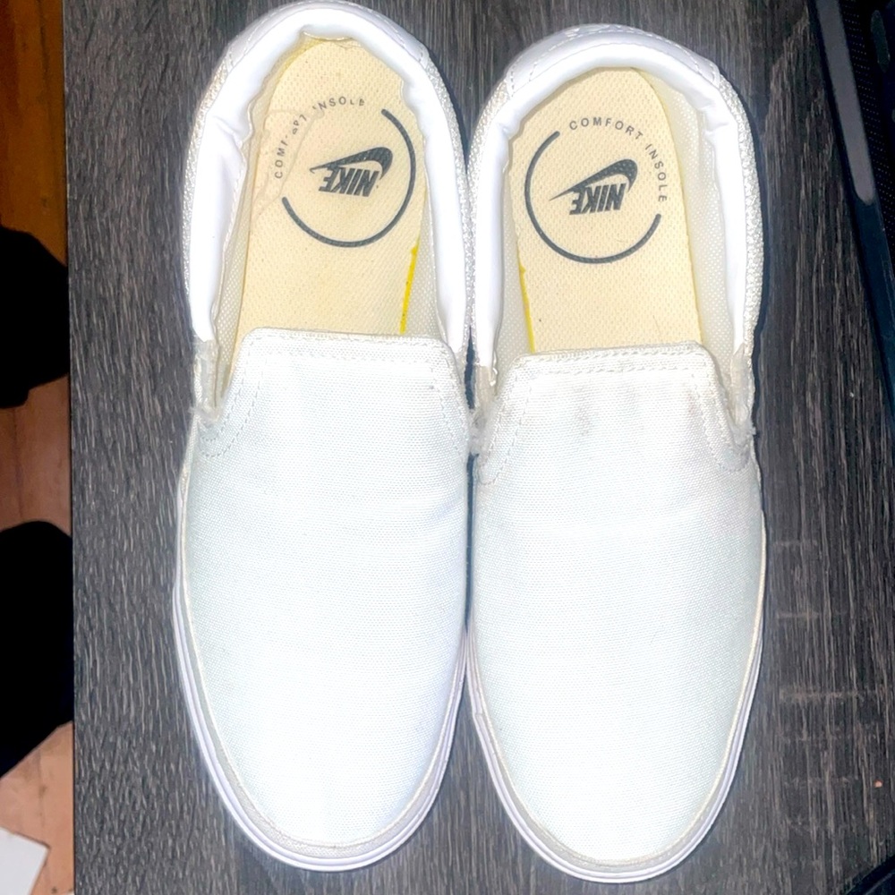 White Nike canvas slip ons